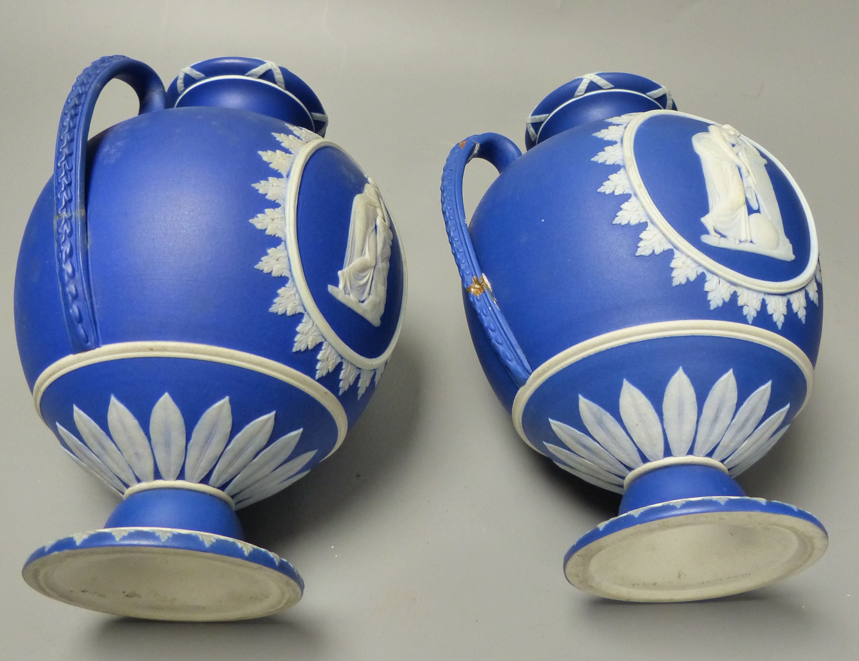 Four pieces of Wedgwood jasper wares including a pair of Victorian blue jasper vases, height 18.5cm, and later dish and pin dish